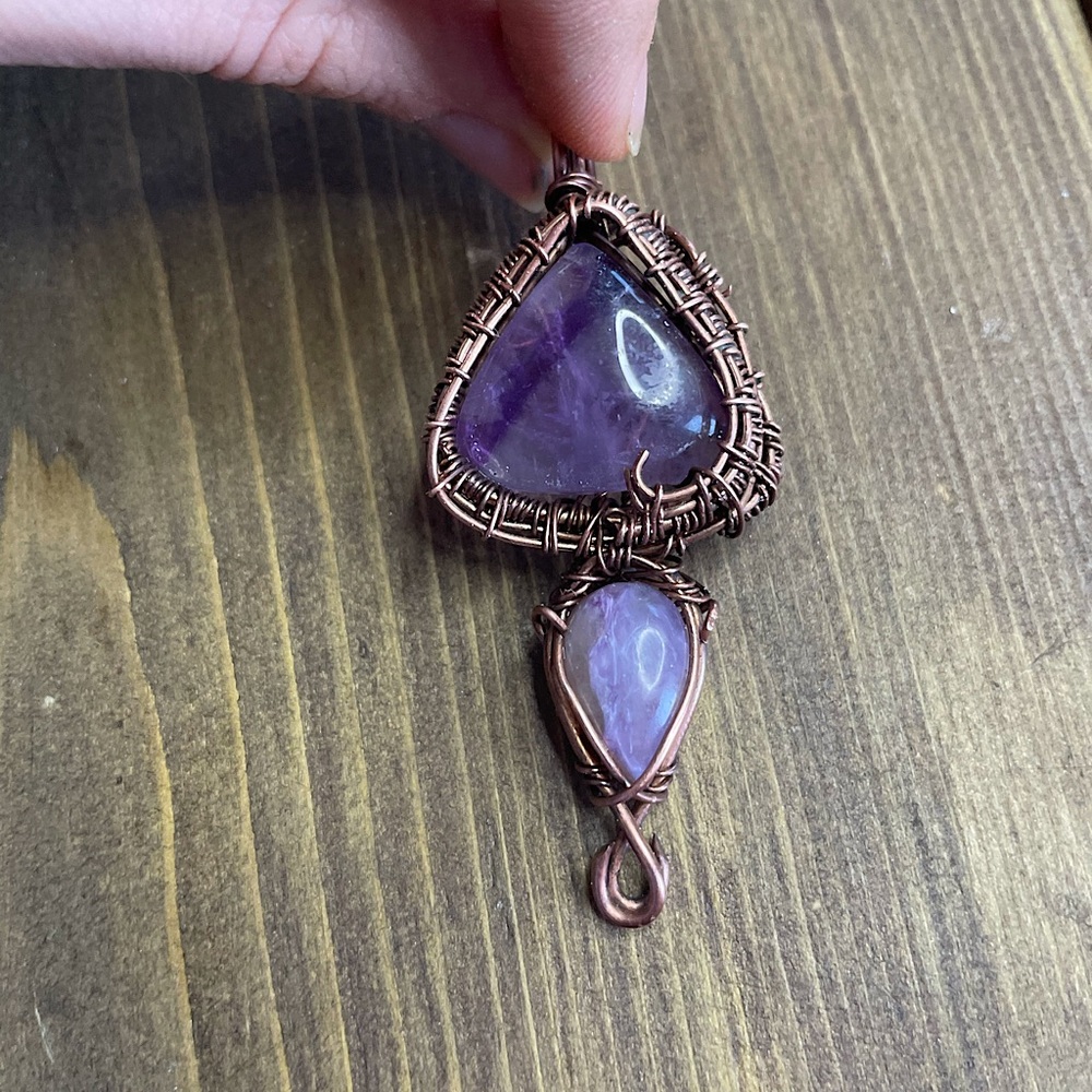 Selling hand wrapped pendant. Amethyst and Chariote crystals. One of a kind